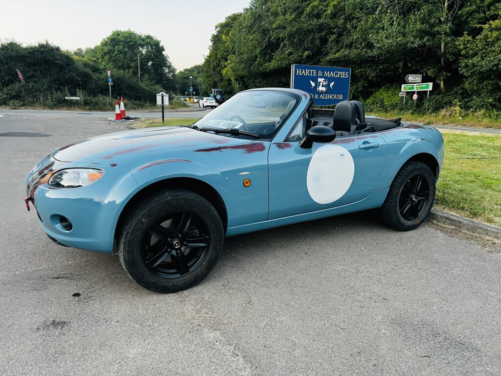 Mazda MX5 called Venom painted purely for fun to look like a battered race car. Also known as the road runner car.